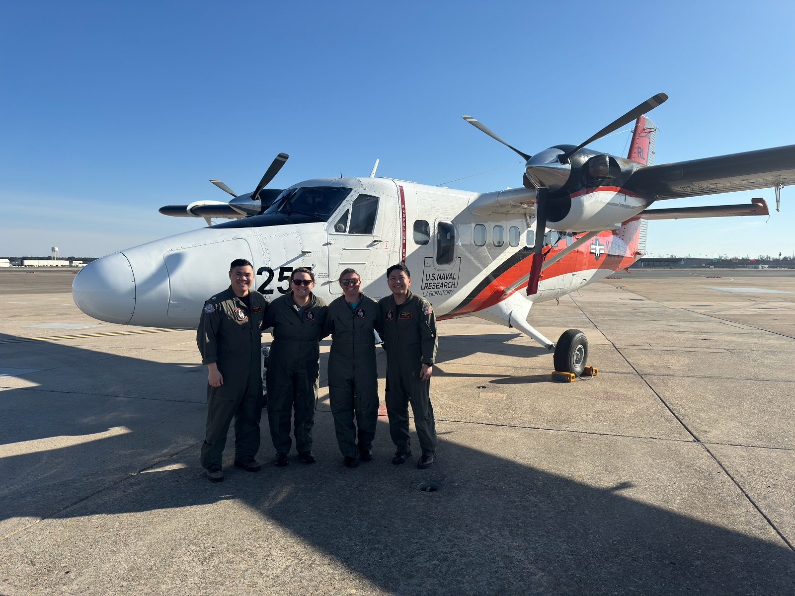 Navy pilots and civilian marine mammal observers with the VXS-1 Twin Otter